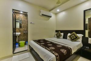 Postel nebo postele na pokoji v ubytování Hotel Guestinn Residency