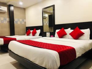 Postel nebo postele na pokoji v ubytování Hotel Guestinn Residency