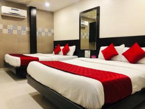 Postel nebo postele na pokoji v ubytování Hotel Guestinn Residency