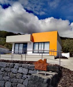 a building with a sign in front of it at Casa da Bella in Velas