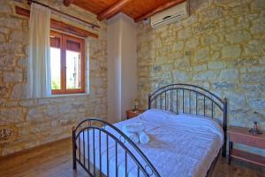 Posteľ alebo postele v izbe v ubytovaní Villa Nipos by PosarelliVillas