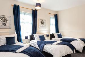Ένα ή περισσότερα κρεβάτια σε δωμάτιο στο Fabulous Stay - 4 Bedroom House, sleeps 9, ideal for Business and Contractors, Free parking