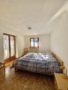 a bedroom with a bed in the middle of it at La Maison De Chouflette in Cogne
