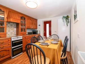 a dining room with a table and chairs in a kitchen at 4 Gordon Street in Buckie