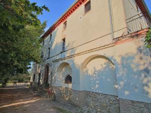 a building with two bikes parked next to it at Farmhouse in Umbertide with Pool in Umbertide +32 photos