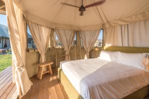 Voodi või voodid majutusasutuse Terme di Vulci Glamping & Spa toas +37 fotot