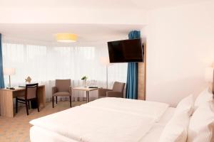 Postel nebo postele na pokoji v ubytování Hotel Frisia