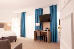 Postel nebo postele na pokoji v ubytování Hotel Frisia