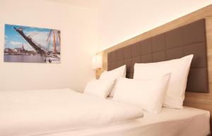 Postel nebo postele na pokoji v ubytování Hotel Frisia