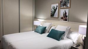 Posteľ alebo postele v izbe v ubytovaní Apartamentos Castrón Douro