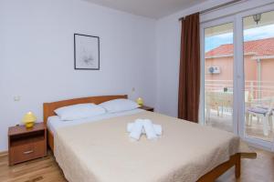 Posteľ alebo postele v izbe v ubytovaní Apartments Darjan