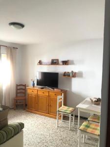 Μια τηλεόραση ή/και κέντρο ψυχαγωγίας στο Casa en primera línea de playa