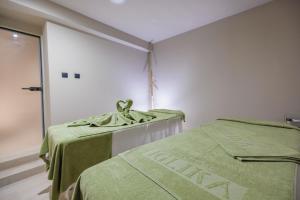 Postel nebo postele na pokoji v ubytování Iglika Hotel & Villas Borovets