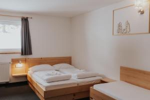 Un pat sau paturi într-o cameră la Hotel House Rozka