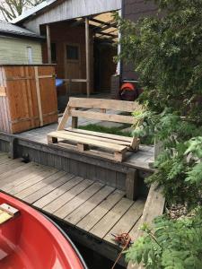 a wooden deck in front of a house at Ferienwohnung Ambiente in Bedekaspel +10 photos