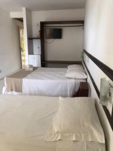 Postel nebo postele na pokoji v ubytování Mar & Sol Praia Hotel