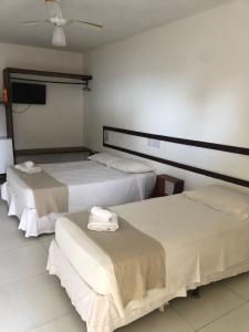 Postel nebo postele na pokoji v ubytování Mar & Sol Praia Hotel