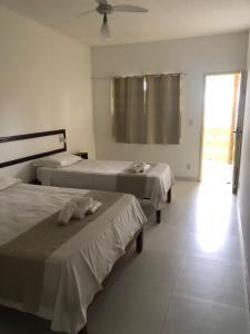 Postel nebo postele na pokoji v ubytování Mar & Sol Praia Hotel