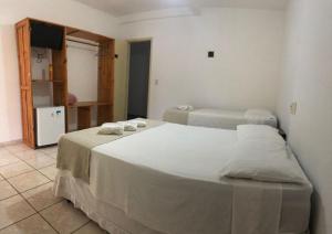 Postel nebo postele na pokoji v ubytování Mar & Sol Praia Hotel