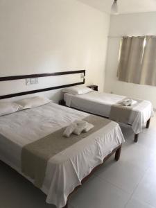 Postel nebo postele na pokoji v ubytování Mar & Sol Praia Hotel