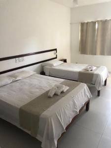 Postel nebo postele na pokoji v ubytování Mar & Sol Praia Hotel