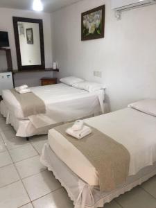 Postel nebo postele na pokoji v ubytování Mar & Sol Praia Hotel + 37 fotografií