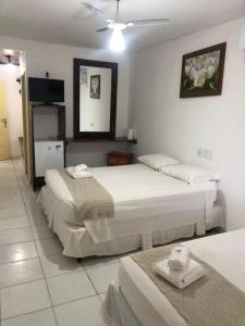 Postel nebo postele na pokoji v ubytování Mar & Sol Praia Hotel
