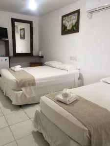 Postel nebo postele na pokoji v ubytování Mar & Sol Praia Hotel