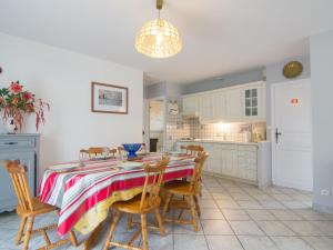a kitchen with a dining room table and chairs at Holiday Home Picasso by Interhome in Lacanau-Océan