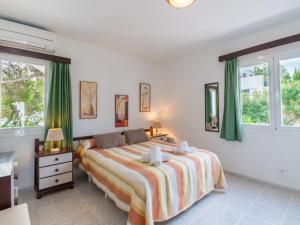 A bed or beds in a room at Holiday Home Anromi by Interhome
