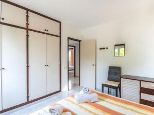 A bed or beds in a room at Holiday Home Anromi by Interhome