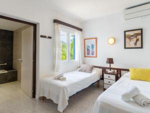 A bed or beds in a room at Holiday Home Anromi by Interhome