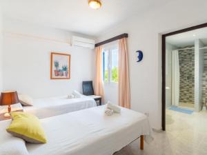 A bed or beds in a room at Holiday Home Anromi by Interhome