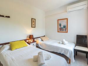 A bed or beds in a room at Holiday Home Anromi by Interhome