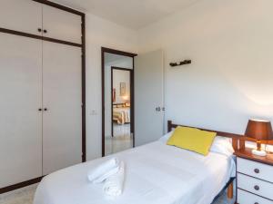 A bed or beds in a room at Holiday Home Anromi by Interhome