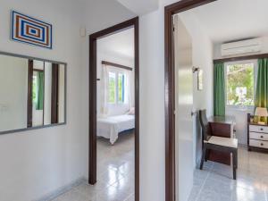 A bed or beds in a room at Holiday Home Anromi by Interhome
