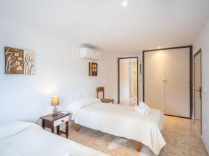 A bed or beds in a room at Holiday Home Anromi by Interhome