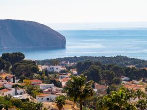 a view of a town and the ocean at Holiday Home El Olivo by Interhome in Moraira