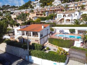 an aerial view of a house with a swimming pool at Holiday Home El Olivo by Interhome in Moraira