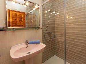 a bathroom with a sink and a shower at Holiday Home Montalt I by Interhome in Miami Platja