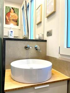 a bathroom with a white sink on a counter at Baccaro's home B&B in Brindisi +7 photos