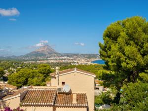 a view of a house with a mountain in the background at Holiday Home Toscacasita by Interhome in Balcon del Mar