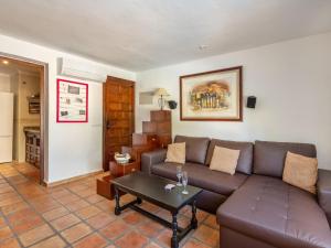 a living room with a couch and a table at Holiday Home Toscacasita by Interhome in Balcon del Mar