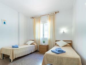 Postel nebo postele na pokoji v ubytování Apartment Gran Reserva-12 by Interhome
