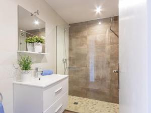 a bathroom with a shower with a sink and a toilet at Apartment Gran Reserva-12 by Interhome in Empuriabrava