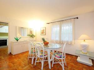a dining room with a table and chairs at Holiday Home Puig Dels Daus by Interhome in Calonge