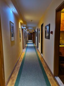 a corridor in a building with a hallway at Hotel Square in Skopje