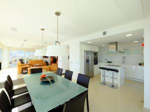 a kitchen and dining room with a table and chairs at Apartment Esmeralda-1 by Interhome in Calpe