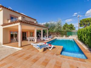 a villa with a swimming pool and a house at Villa Villa Cala Nova B by Interhome in Les tres Cales