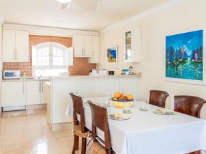 a kitchen and dining room with a table and chairs at Holiday Home Tejon by Interhome in Nerja